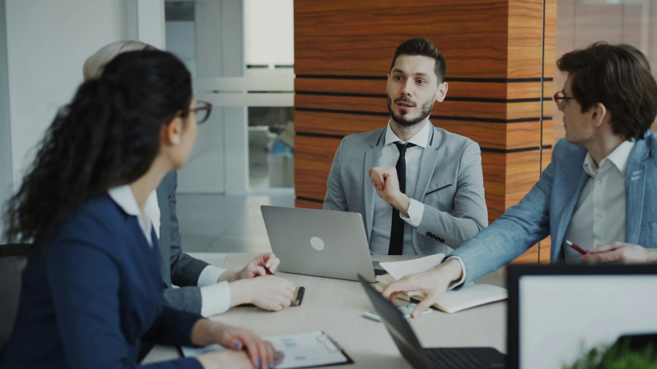 Enterprise team reviewing reports in a boardroom